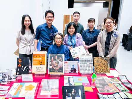 SFU library staff photographed with archives donor at the IAW 2026